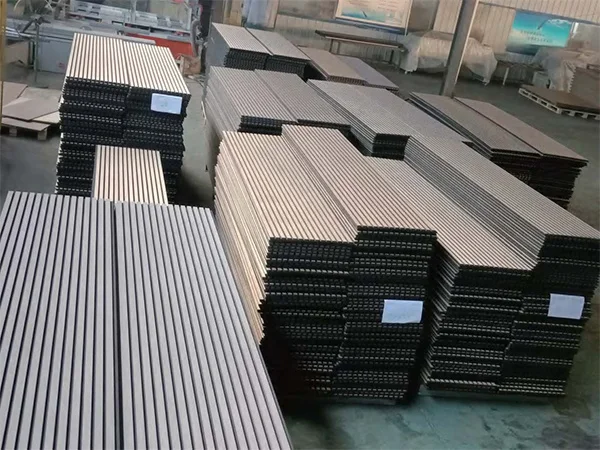 Acoustic wall panels are stacked in different groups by thickness and density.
