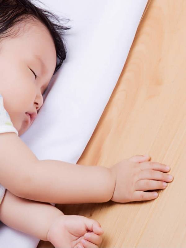 A baby is having a good sleep on the SPC flooring.