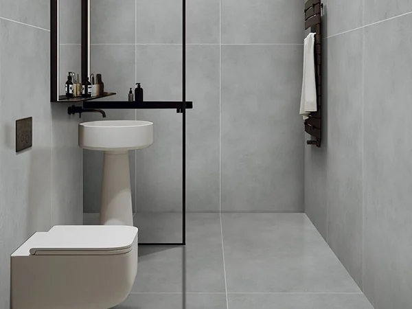 The bathroom decorated with SPC wall panels with a minimalist gray tone.