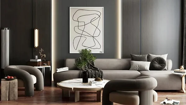 Paneles de pared gris oscuro hacen eco de los muebles suaves, creando un espacio moderno y texturizado.