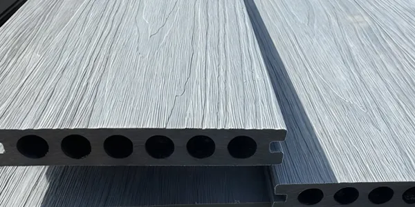 Workers showcasing the details of WPC boards