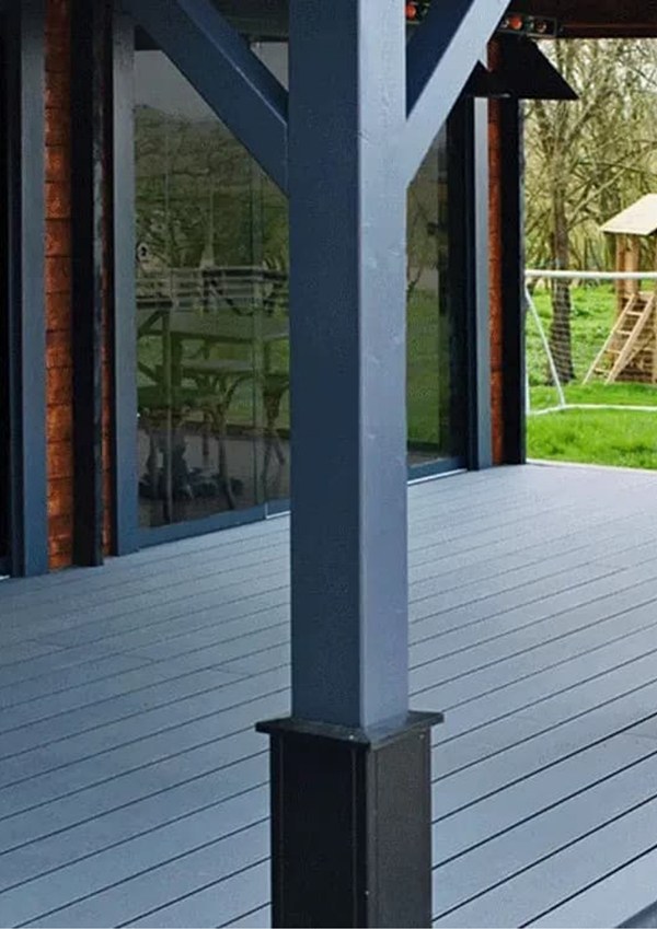 A villa backyard with WPC decking on the ground.