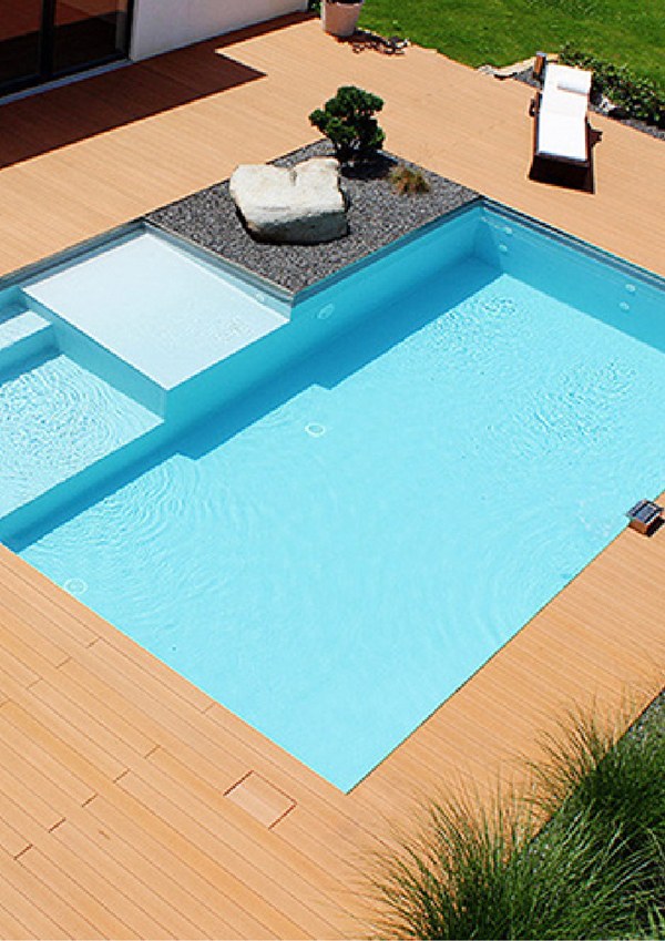 A pool surrounded by WPC decking